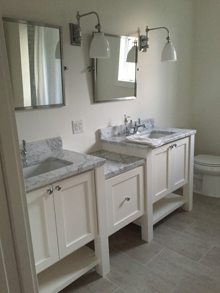 Impact Construction | Hull Iowa | Sioux County Construction near me | Remodeling my home | Updated Bathroom with marble and white cabinets