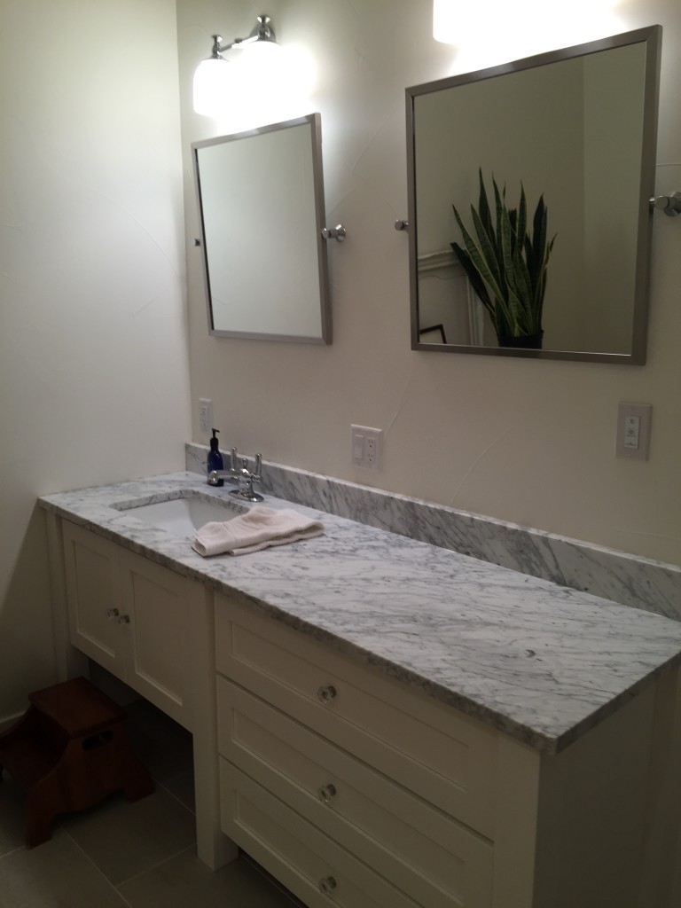 Impact Construction | Hull Iowa | Sioux County Construction near me | Remodeling my home | Updated Bathroom with marble and white cabinets